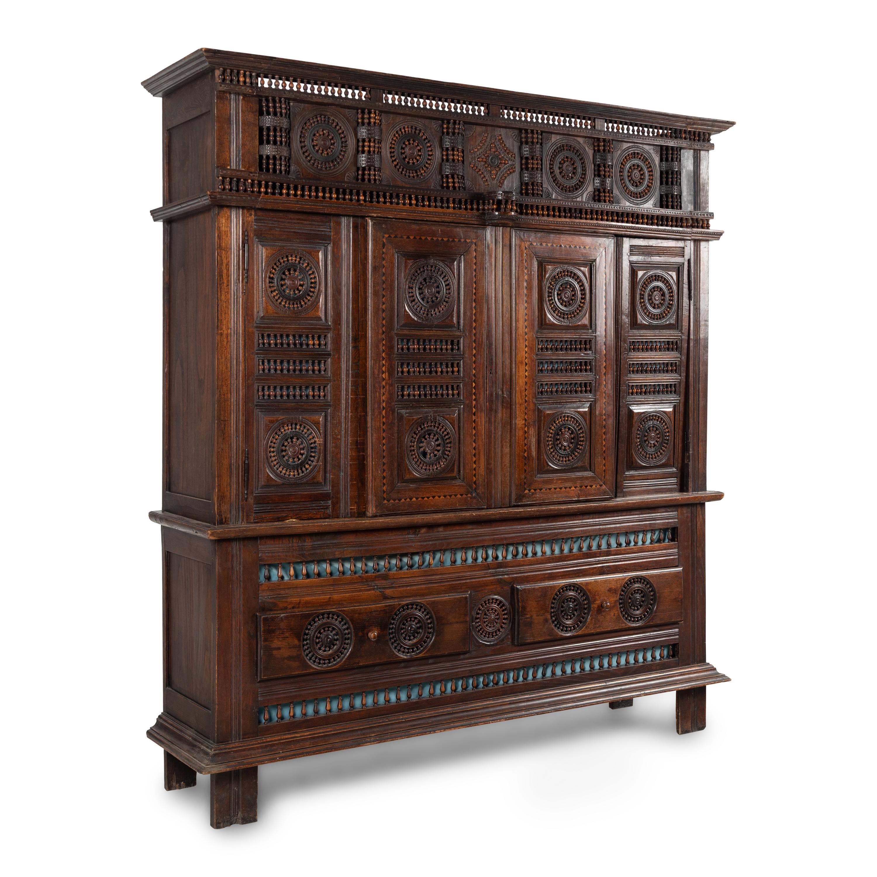 A Breton Carved Walnut Cabinet