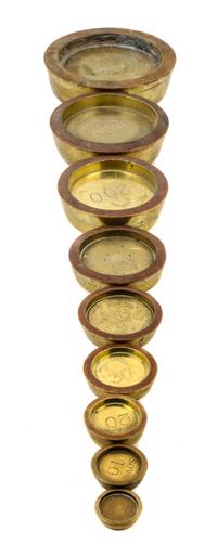 A Set of Nine Brass Sovereign Weights Diameter of largest 6 inches. — WHITEHEAD, MORRIS & CO. LTD AND OTHERS, LONDON, 19TH CENTURY