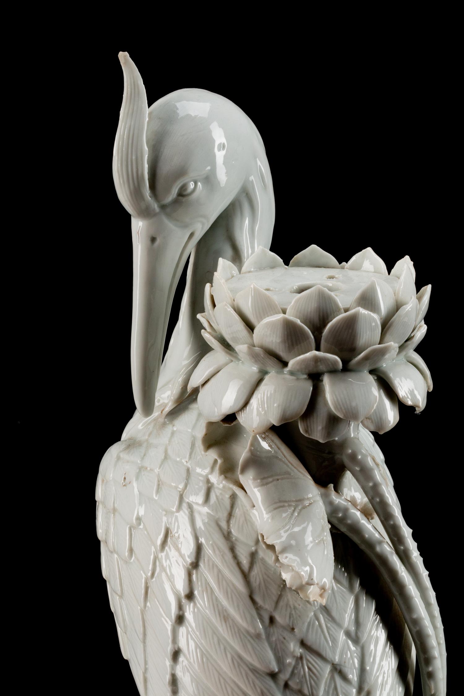 A Pair of Chinese Blanc de Chine Porcelain Crane-Form Candlesticks