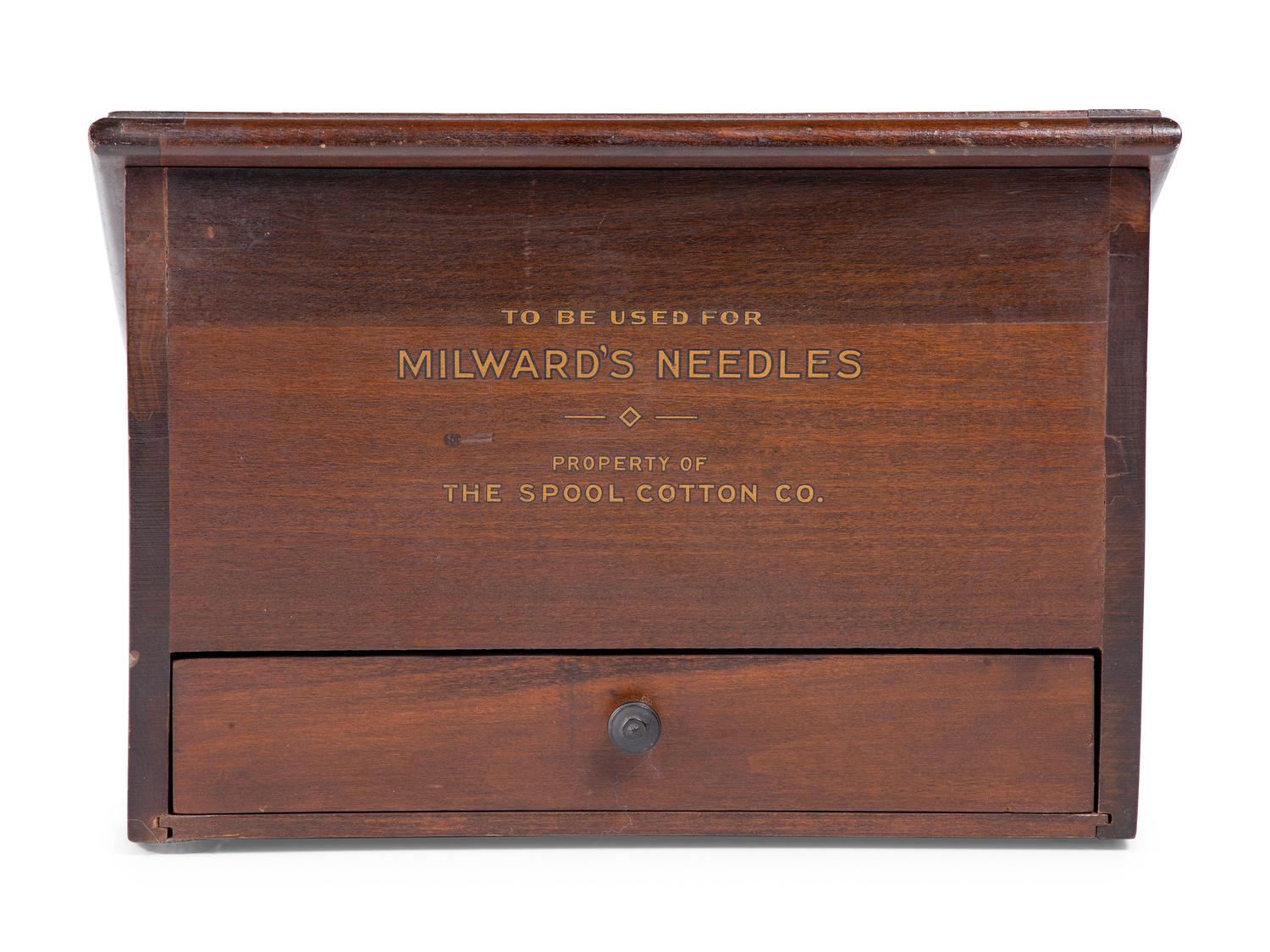 A Milward's English Needles Countertop Display Case