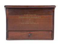 A Milward's English Needles Countertop Display Case