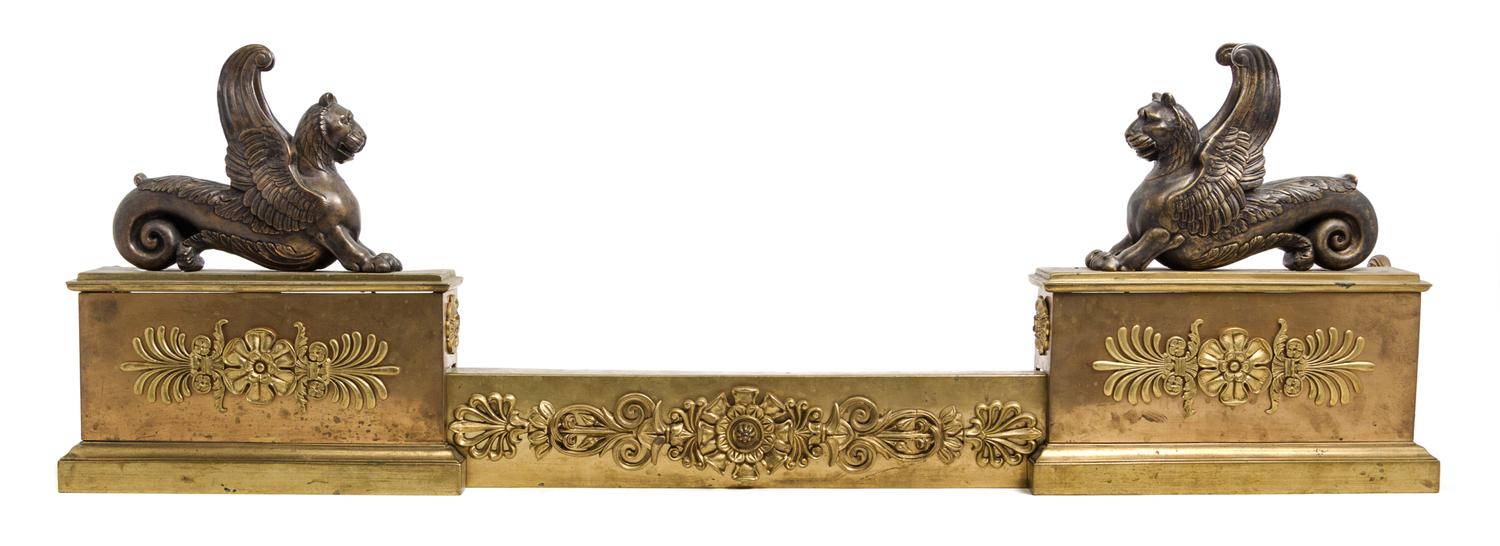 An Empire Style Gilt and Patinated Bronze Fire Guard Height 31 3/4 x width 27 1/4 inches.