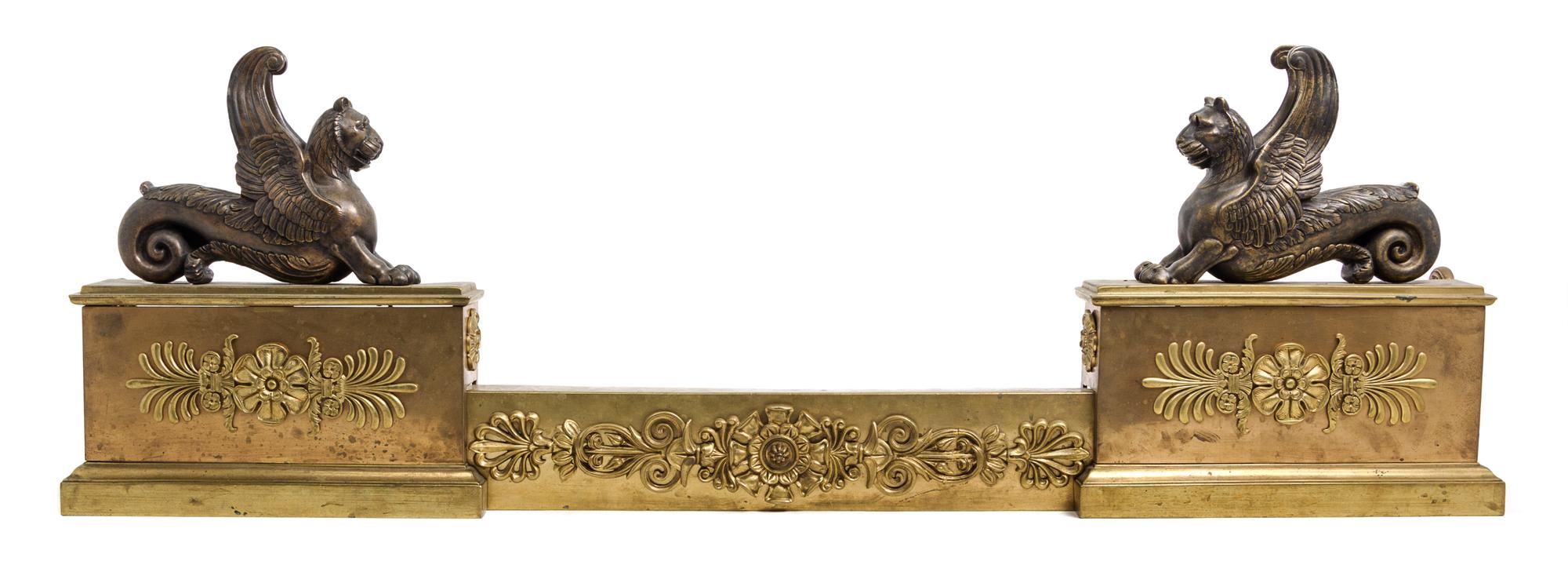 An Empire Style Gilt and Patinated Bronze Fire Guard Height 31 3/4 x width 27 1/4 inches.