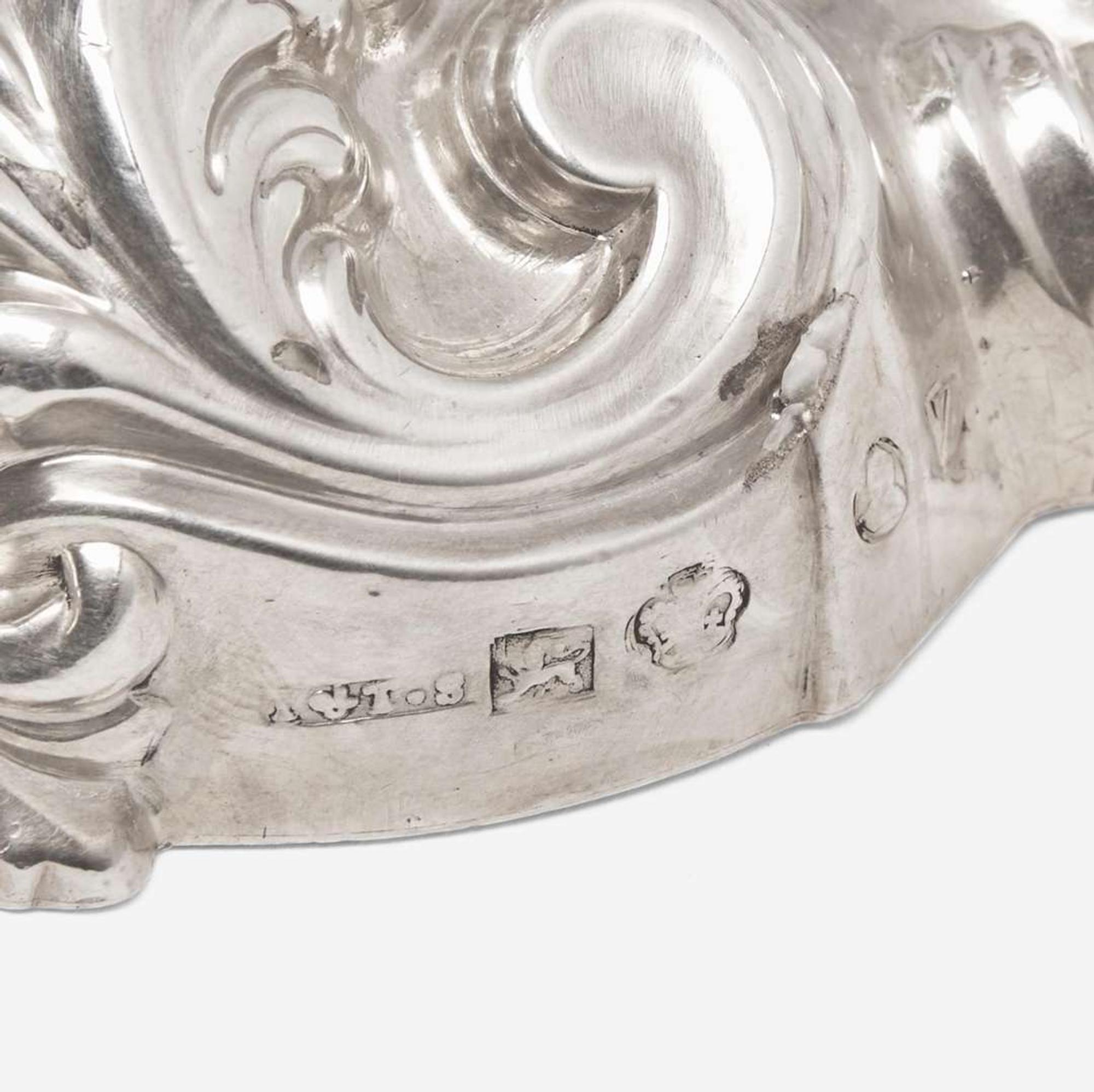 Three pairs of George III / Victorian weighted sterling silver candlesticks in the Rococo manner Various makers, Sheffield, dates ranging 1818-1846