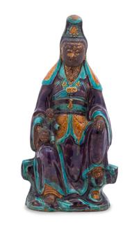 A Chinese Fahua Stoneware Figure of Avalokitesvara MING DYNASTY Height 16 1/4 inches. — MING DYNASTY