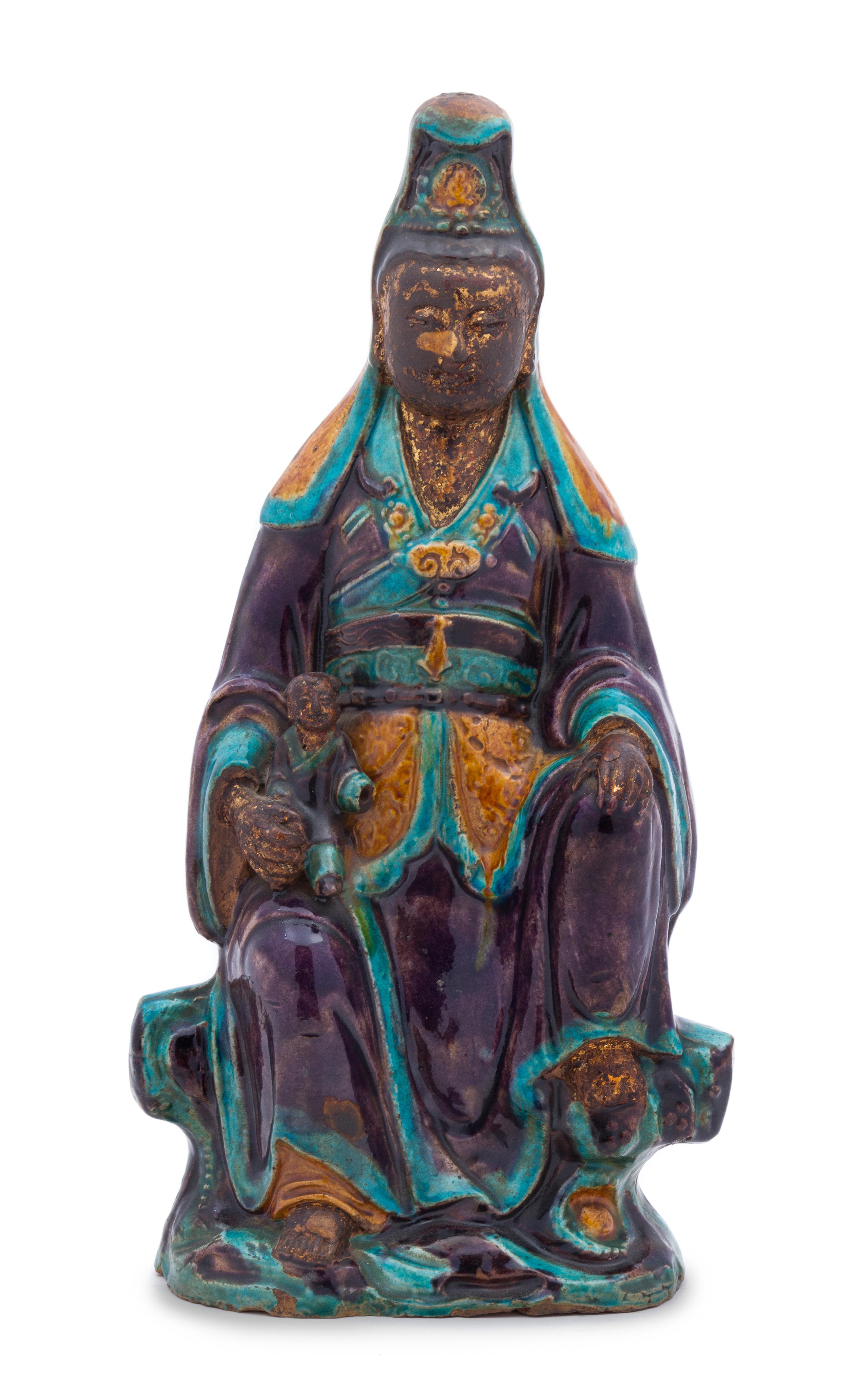 A Chinese Fahua Stoneware Figure of Avalokitesvara MING DYNASTY Height 16 1/4 inches. — MING DYNASTY