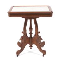 A Victorian Walnut Parlor Table Height 29 3/4 x width 27 x depth 18 3/4 inches. — 19TH CENTURY