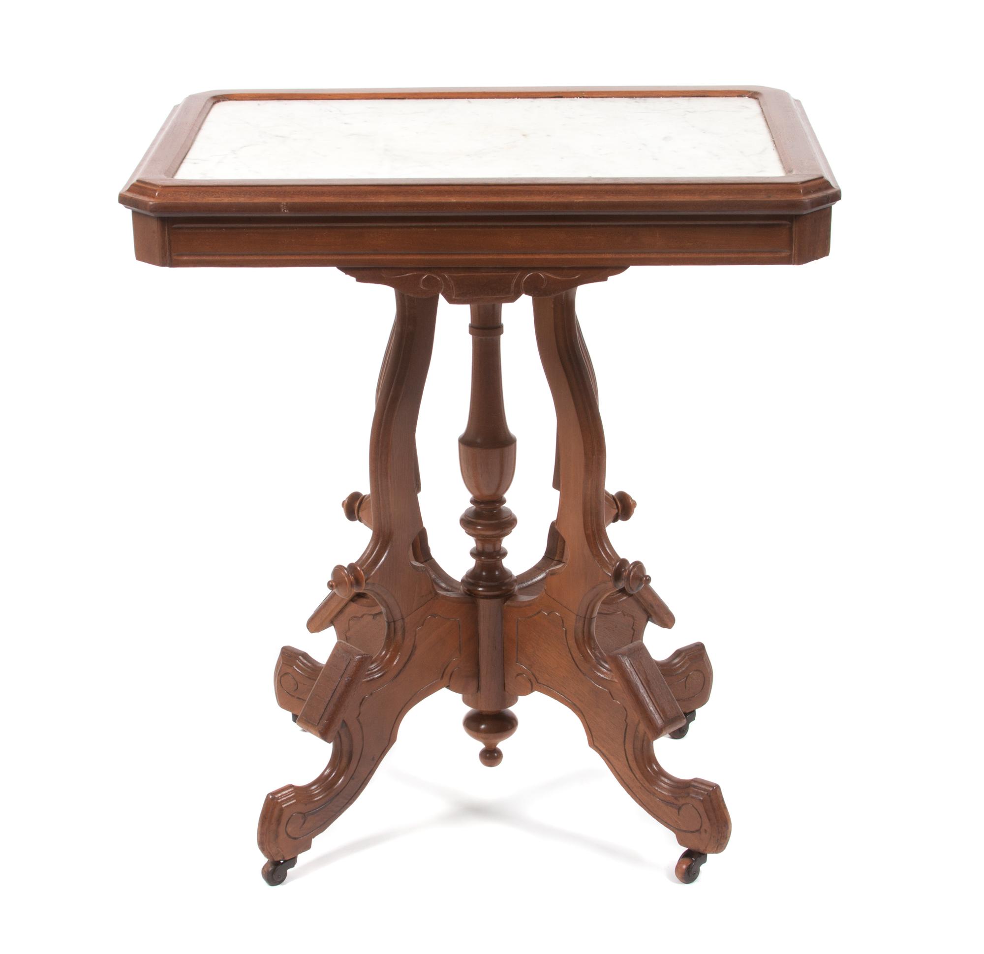 A Victorian Walnut Parlor Table Height 29 3/4 x width 27 x depth 18 3/4 inches. — 19TH CENTURY