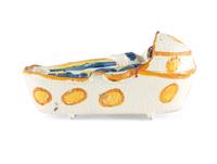 A Staffordshire Pearlware Figure of a Child in a Cradle