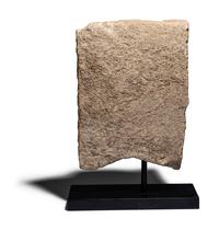 An Egyptian Limestone Fragment with a Dignitary