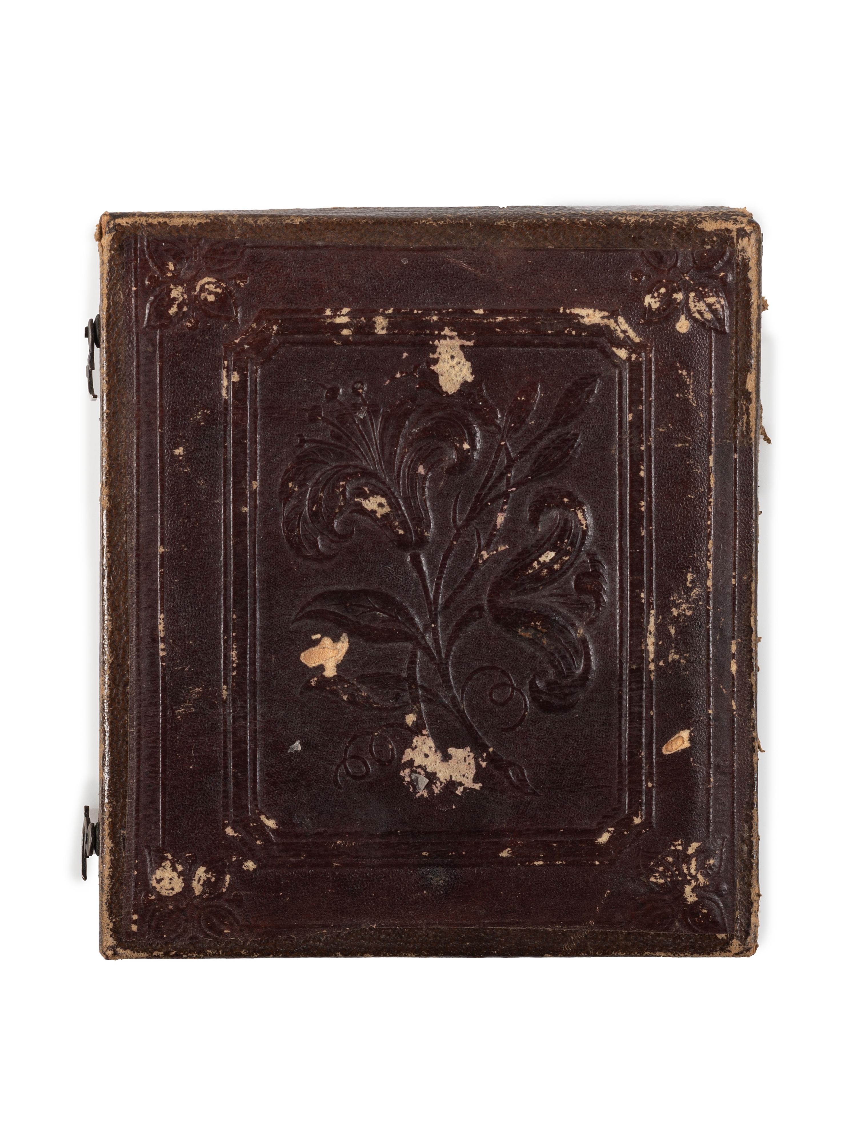 [EARLY PHOTOGRAPHY]. A pair of daguerreotypes of folk art painted portraits, comprising: