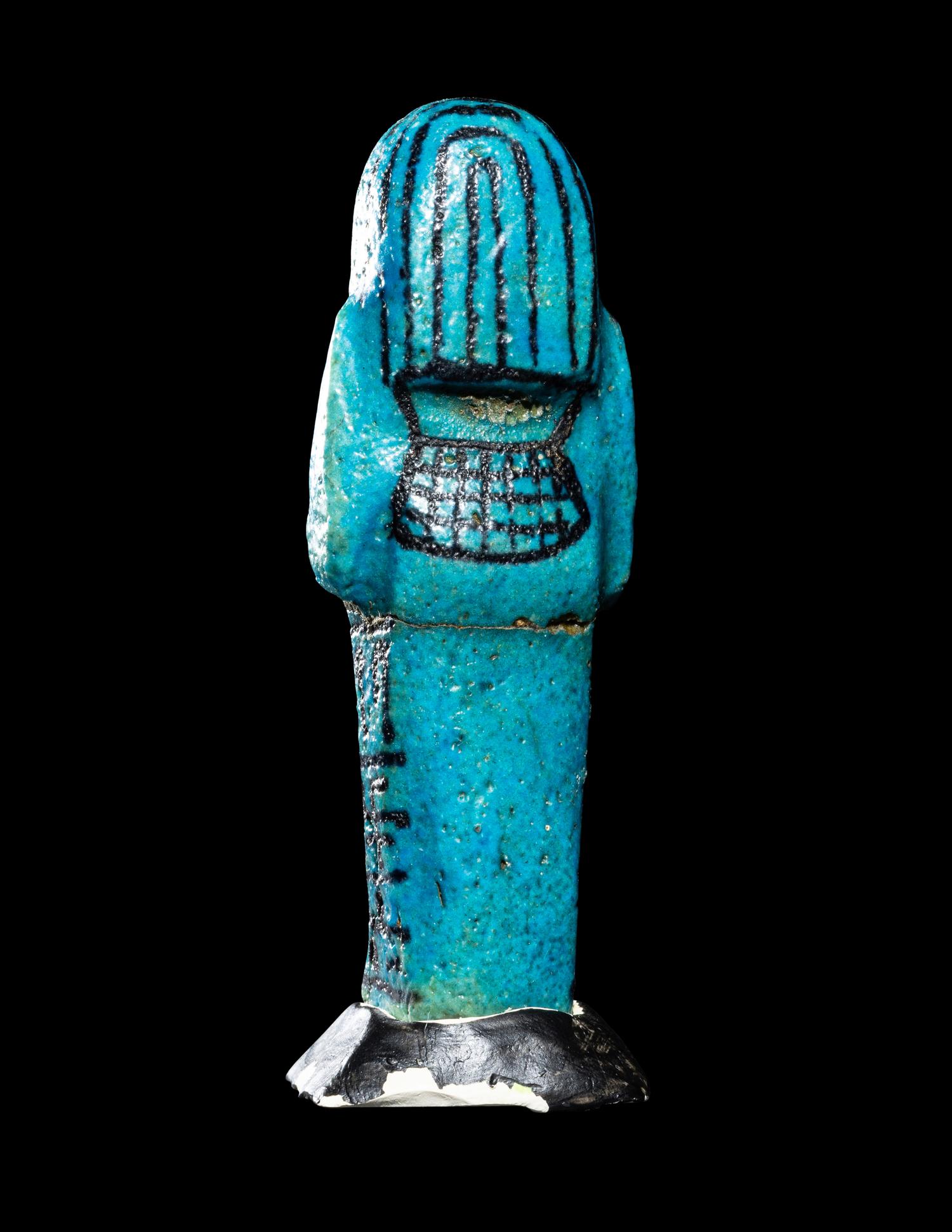 An Egyptian Blue Faience Ushabti for the Mistress of the House and Chantress of Amun, Muthotep