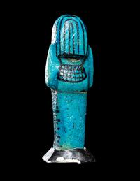 An Egyptian Blue Faience Ushabti for the Mistress of the House and Chantress of Amun, Muthotep