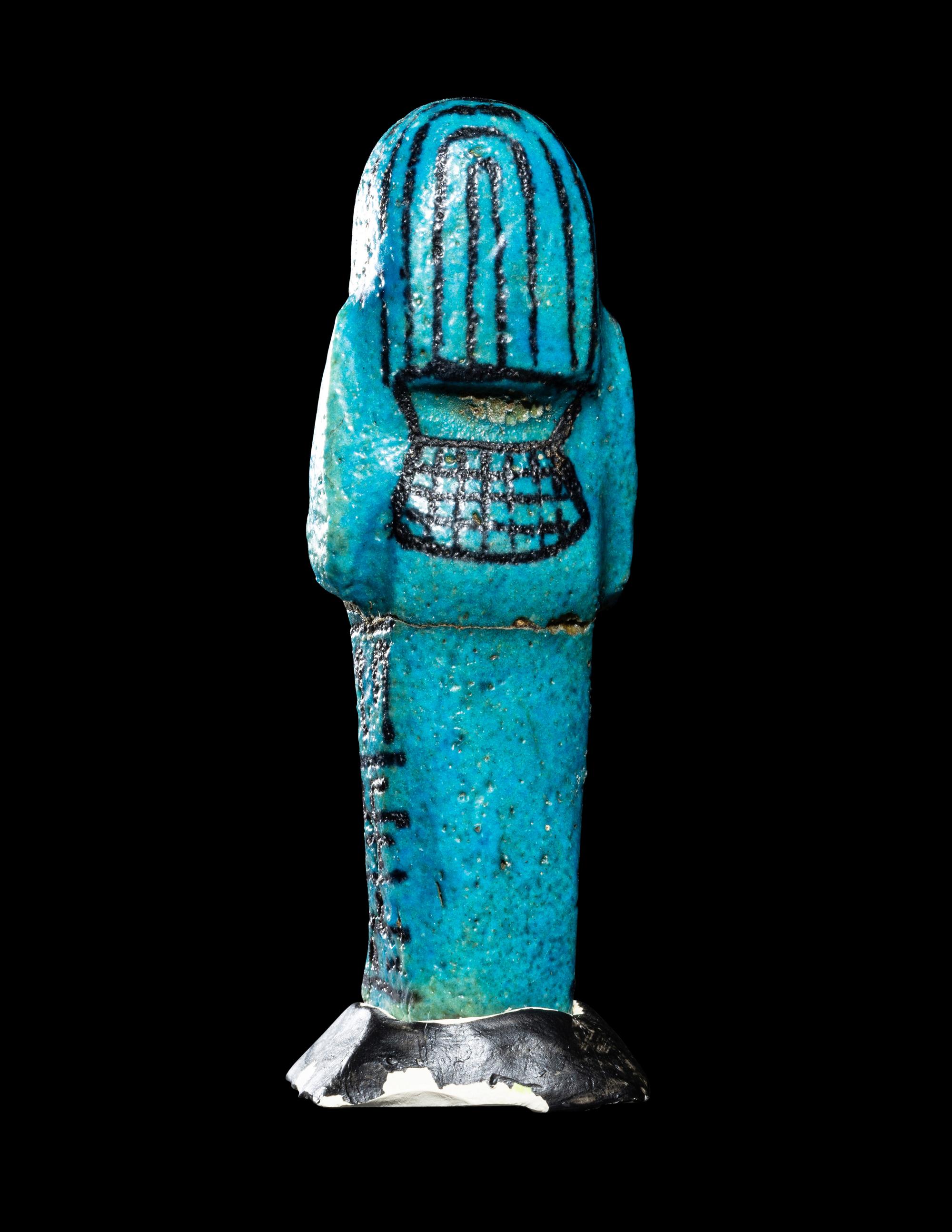 An Egyptian Blue Faience Ushabti for the Mistress of the House and Chantress of Amun, Muthotep
