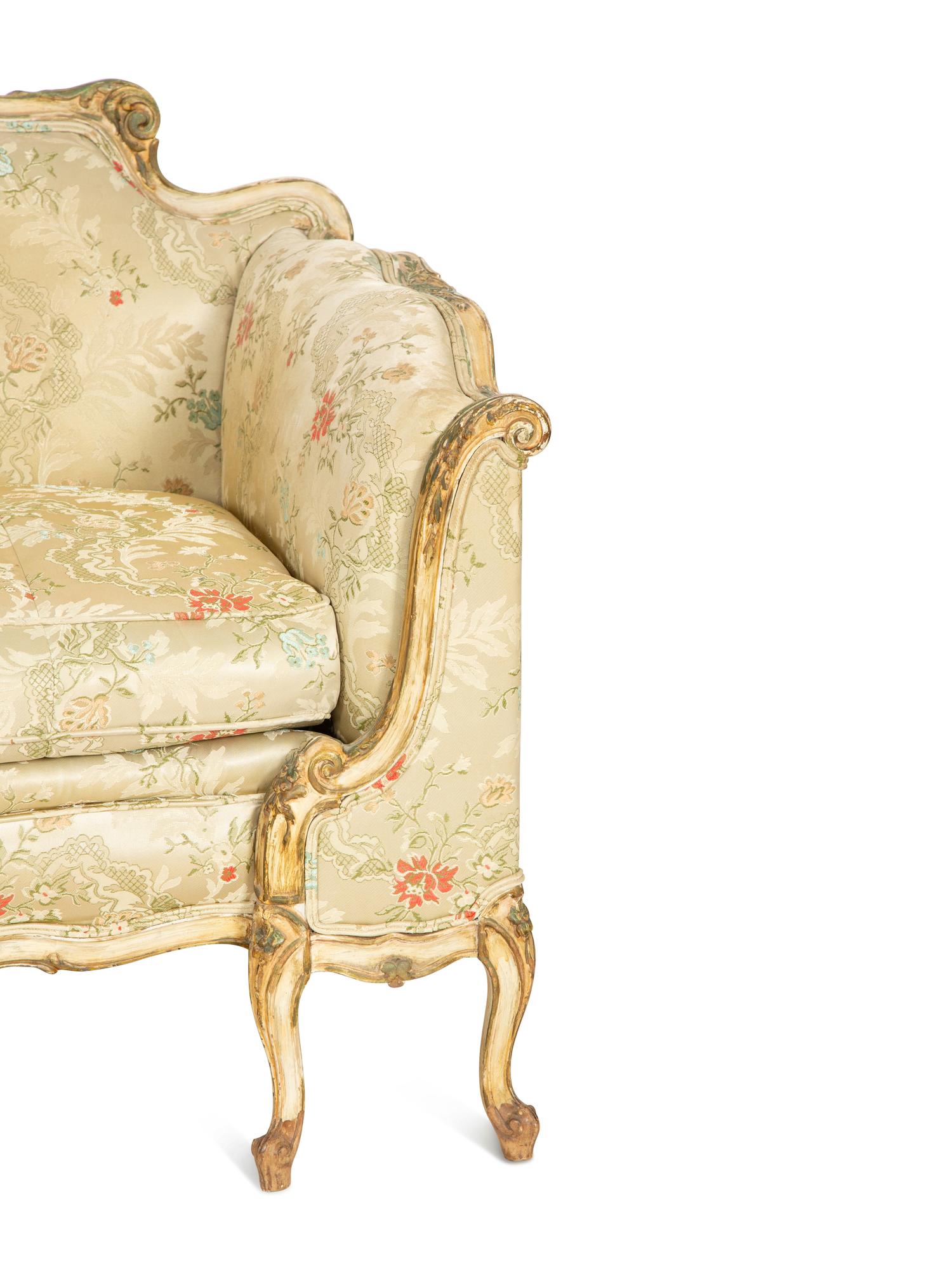 A Louis XV Style Painted and Parcel Gilt Sofa