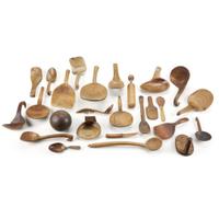 Collection of twenty-four carved and burlwood spoons, ladles, and kitchen implements Most 19th century
