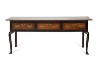 A Queen Anne Oak Three Drawer Sideboard
