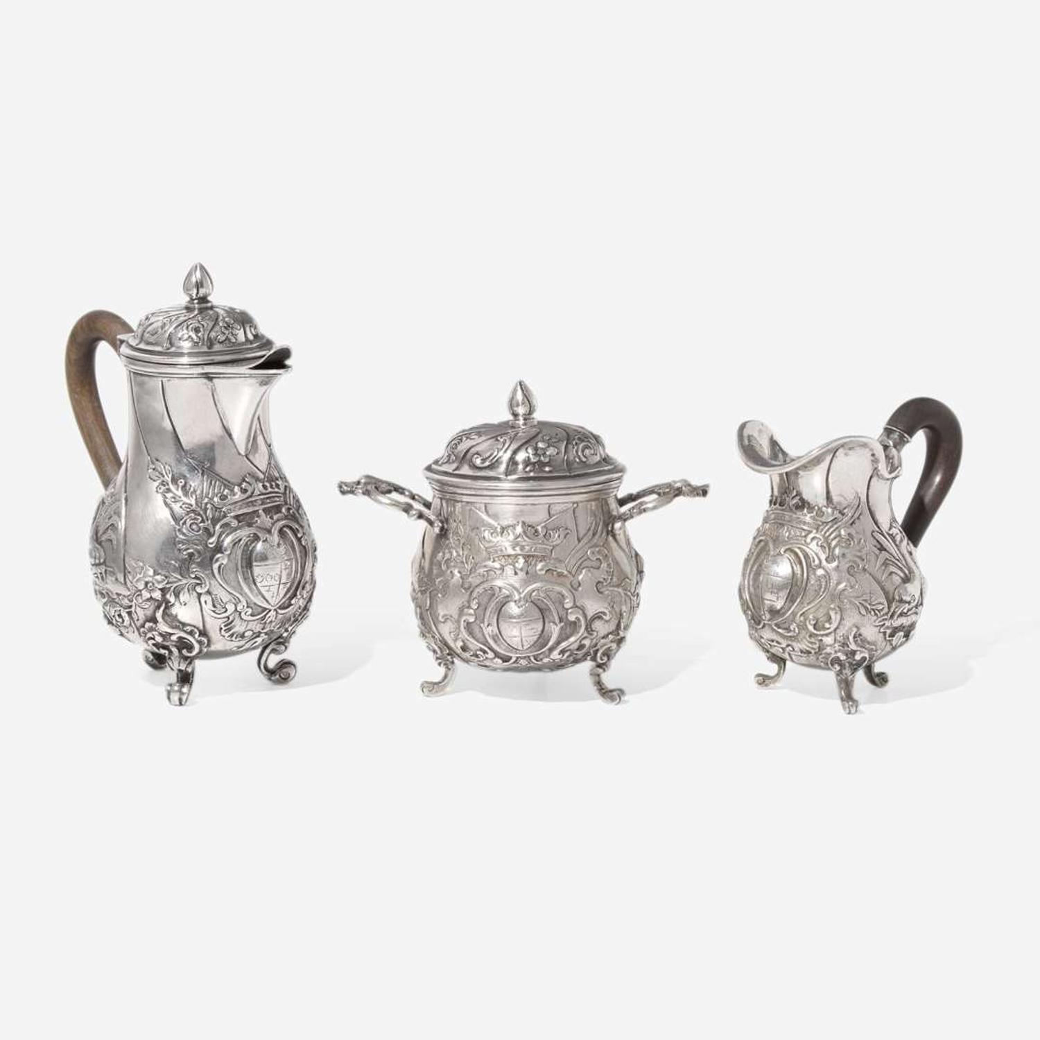 A miniature Continental silver repoussé three-piece coffee service, probably 19th century