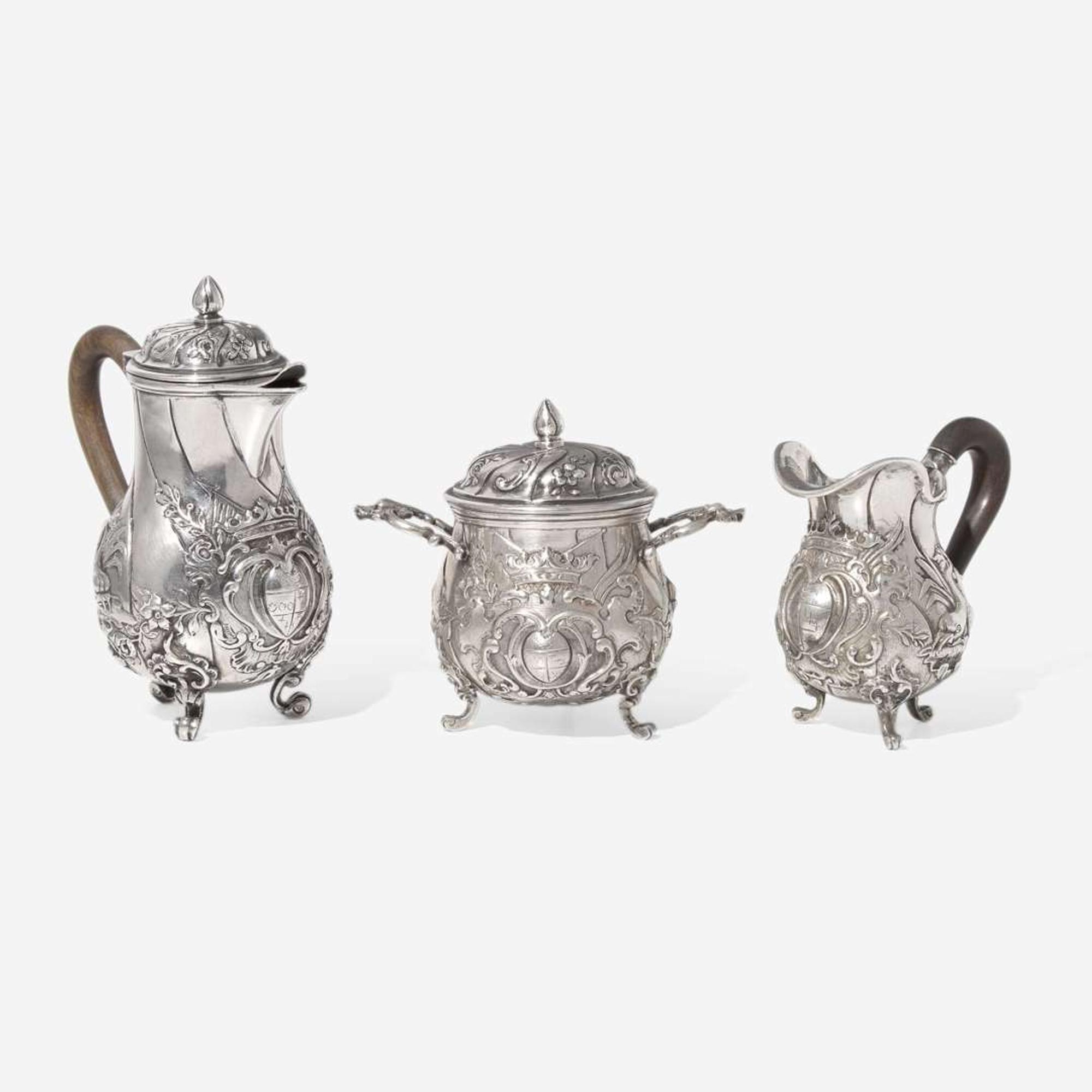 A miniature Continental silver repoussé three-piece coffee service, probably 19th century