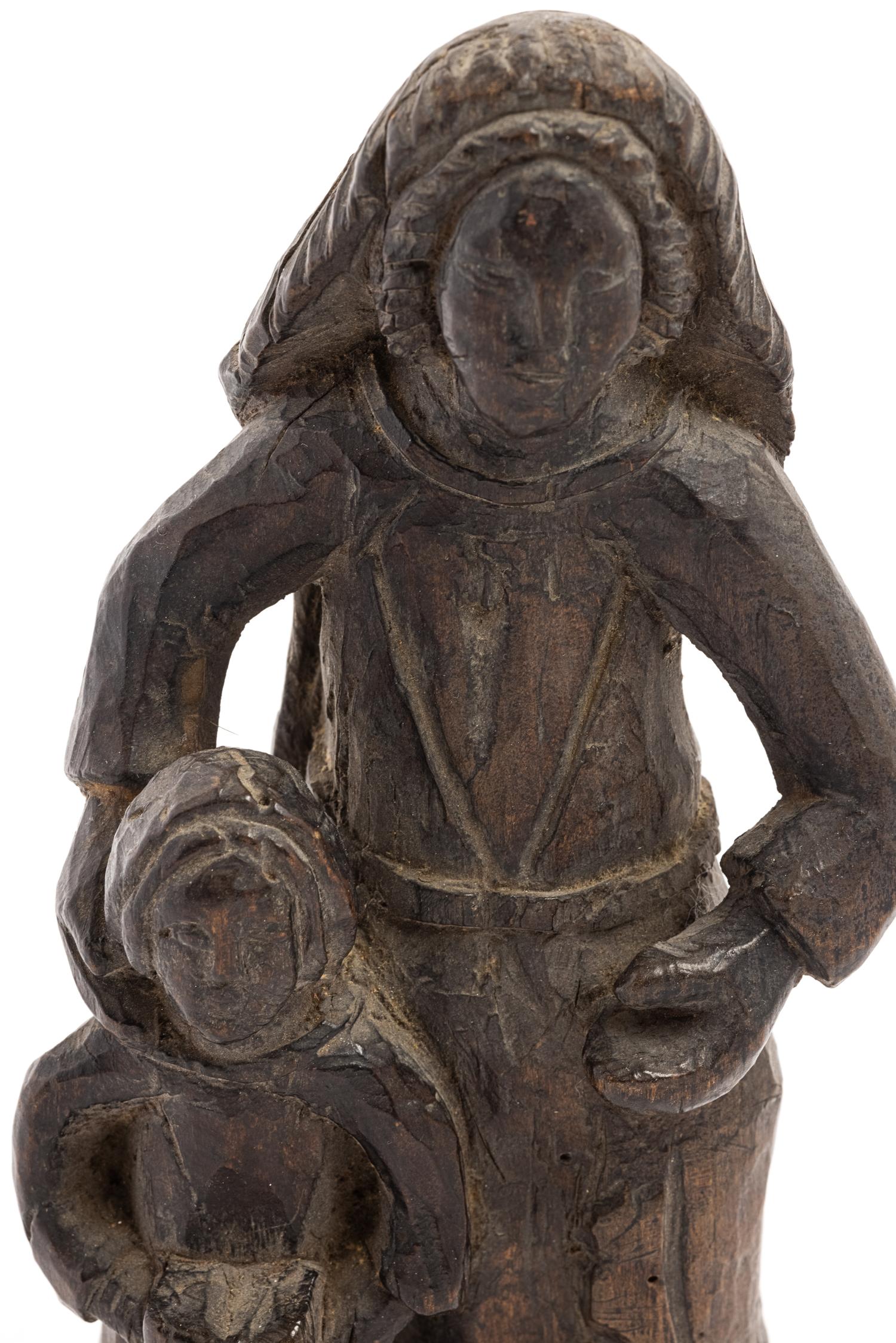 A Continental Carved Wood Figure of a Mother and Child