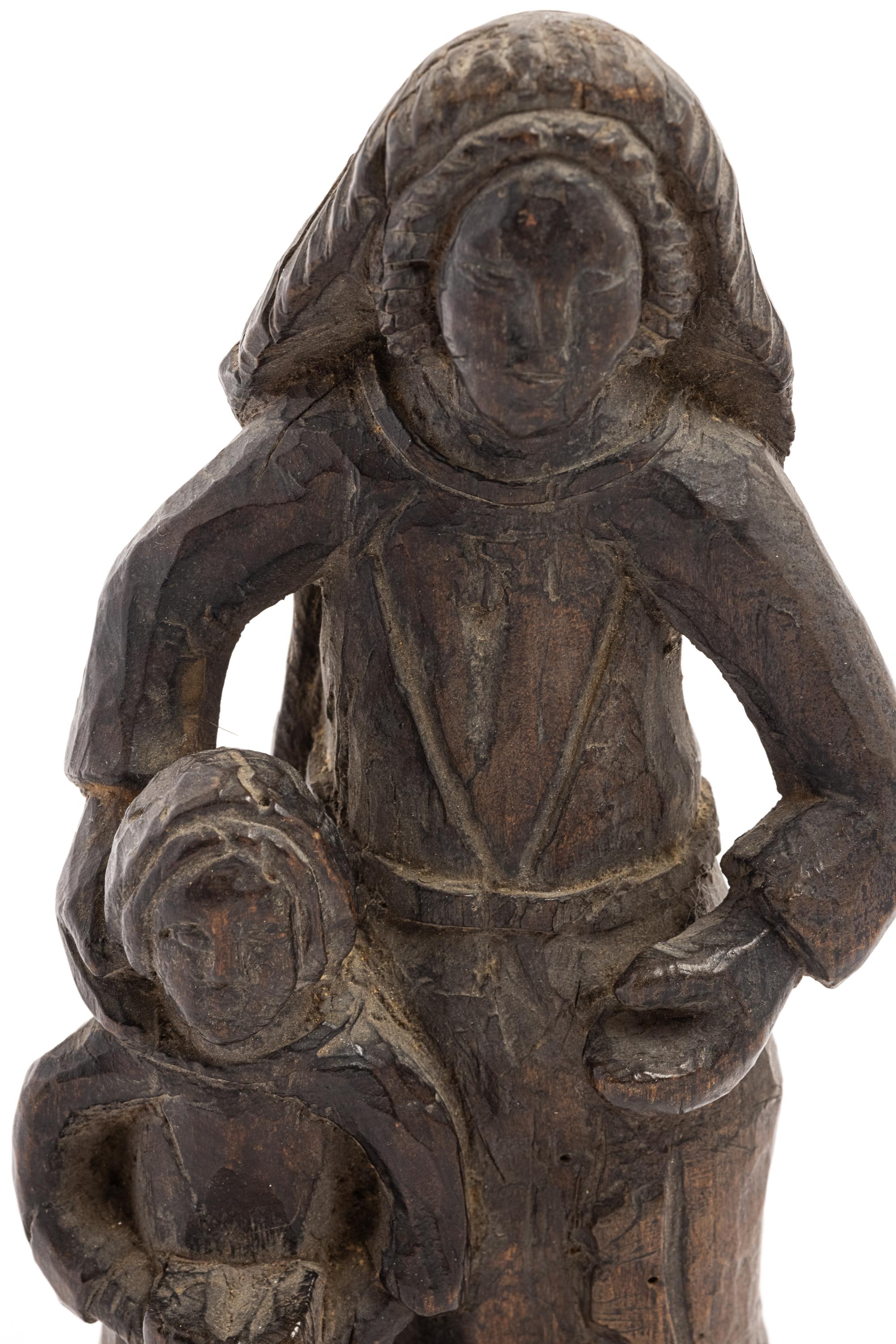 A Continental Carved Wood Figure of a Mother and Child