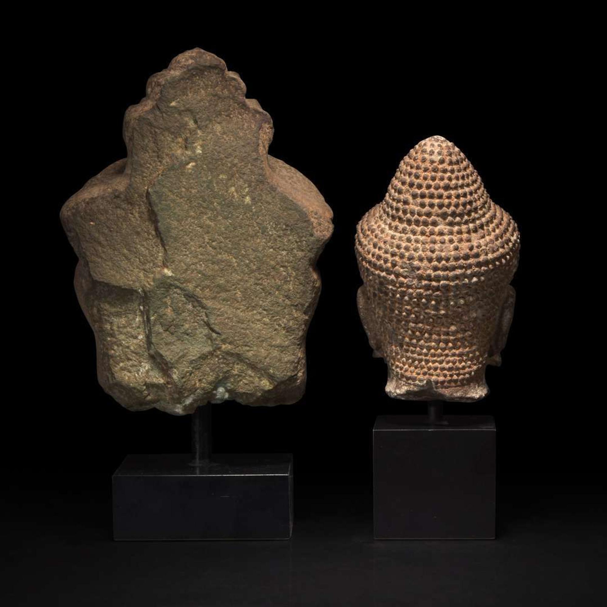 Two Khmer style carved stone heads 高棉风格石雕佛首两件
