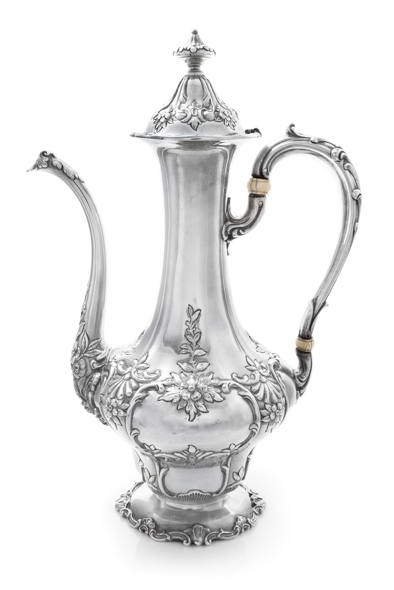 An American Silver Coffee Pot, Gorham Mfg. Co., Providence, RI, the body worked with rocaille, floral, foliate and C-scroll motifs.