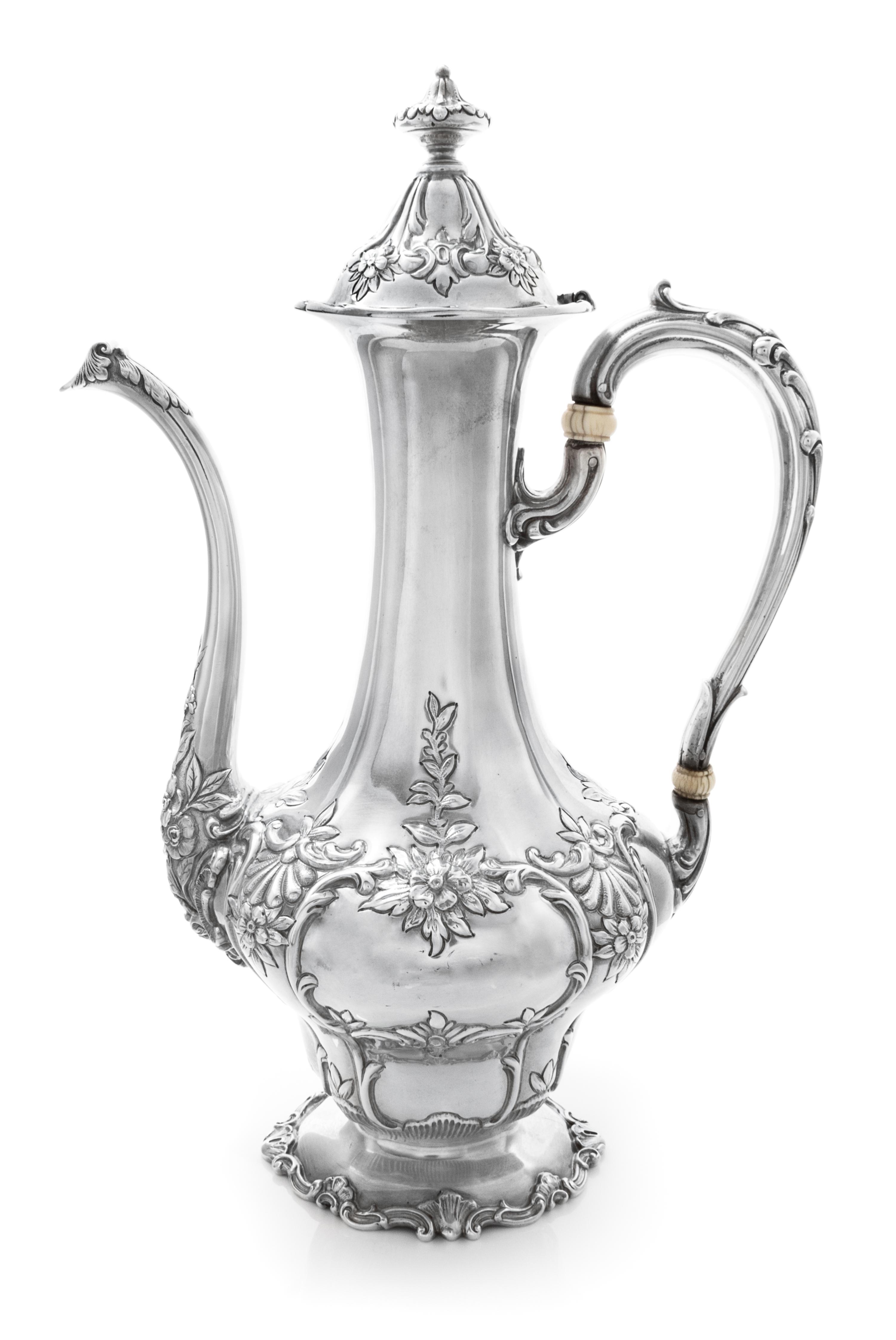 An American Silver Coffee Pot, Gorham Mfg. Co., Providence, RI, the body worked with rocaille, floral, foliate and C-scroll motifs.