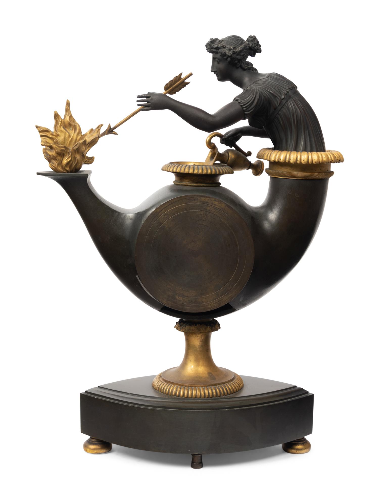 A French Neoclassical Gilt and Patinated Bronze "Oil Lamp" Clock