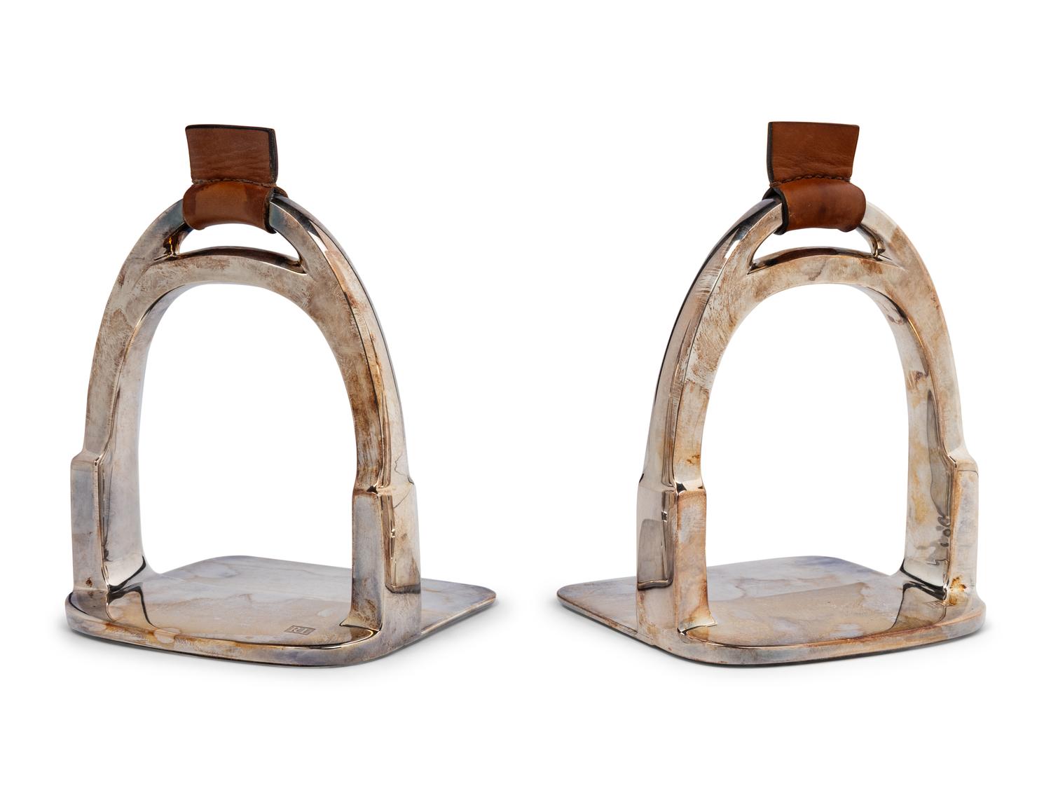 A Pair of Ralph Lauren Silver-Plate and Leather Stirrup-Form Bookends