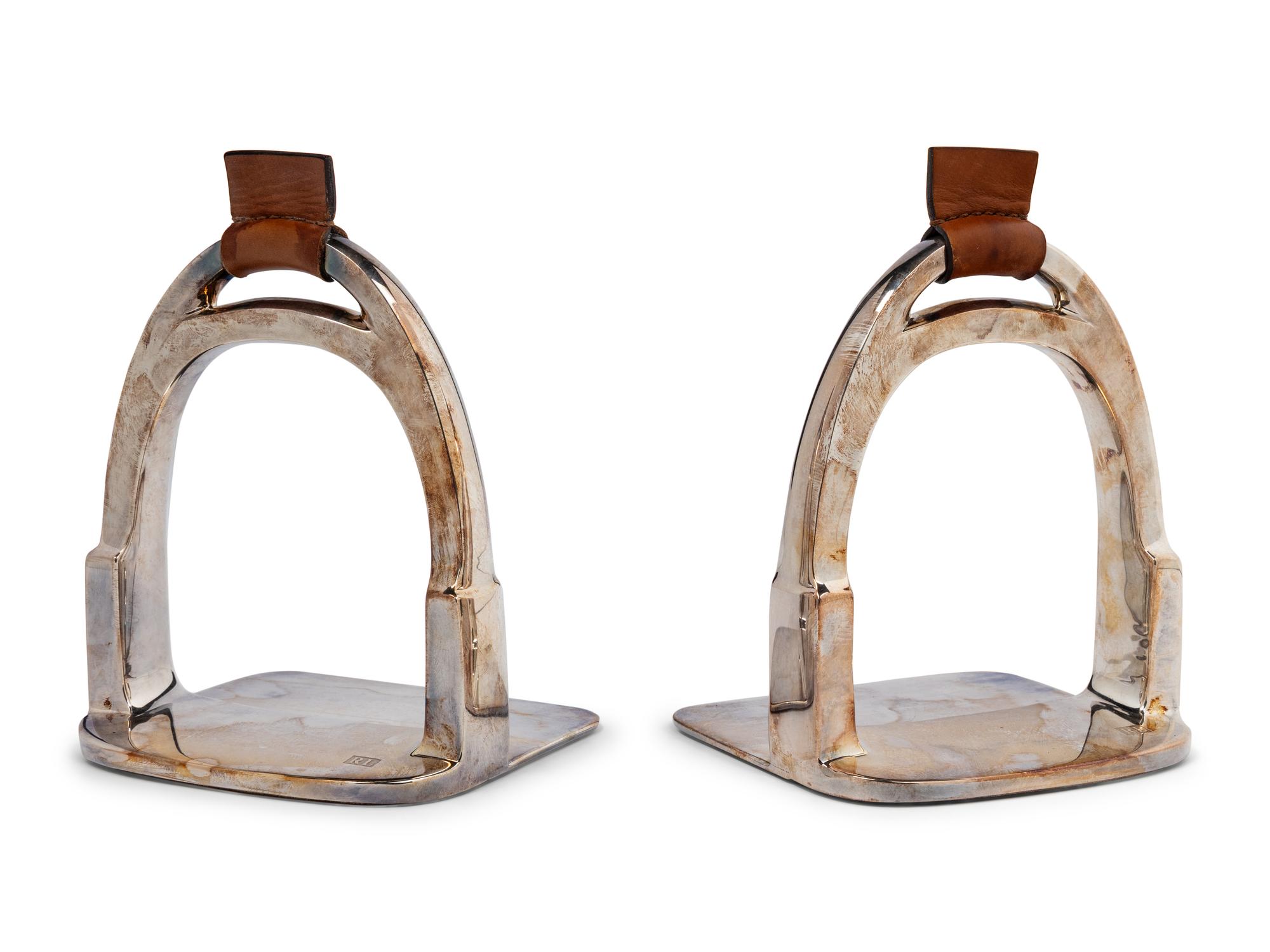 A Pair of Ralph Lauren Silver-Plate and Leather Stirrup-Form Bookends