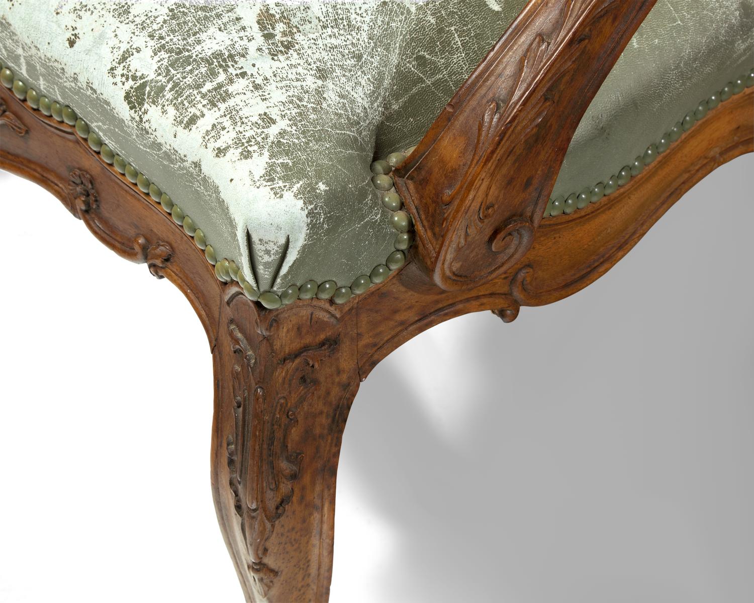 A Pair of Italian Rococo Carved Walnut Armchairs