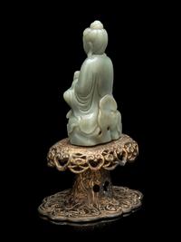 A Chinese Celadon Jade Figure of Seated Guanyin