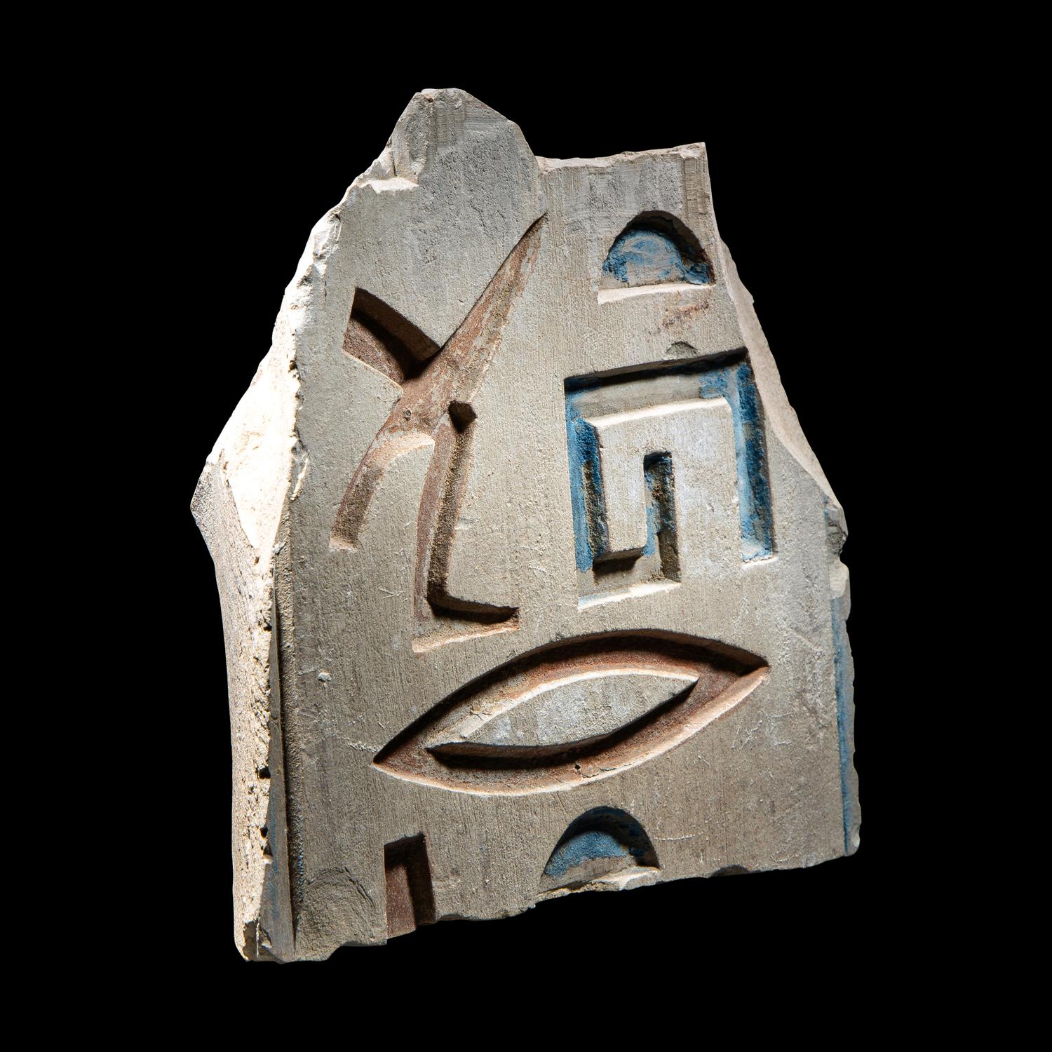 An Egyptian Painted Limestone Relief Fragment