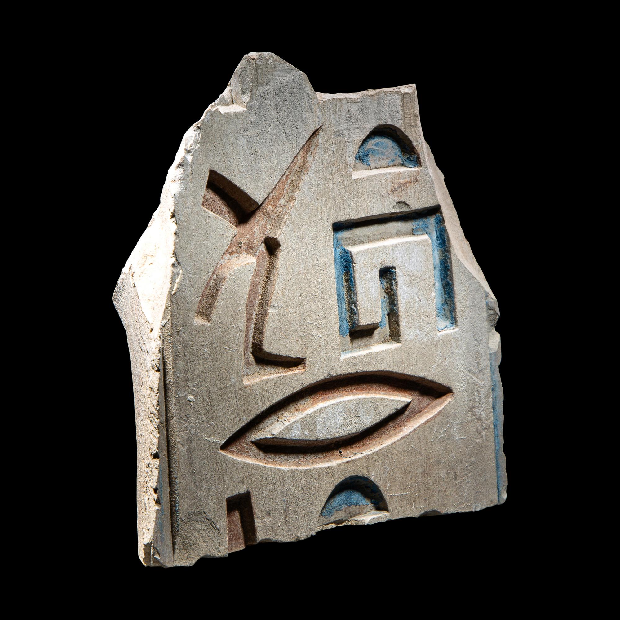 An Egyptian Painted Limestone Relief Fragment