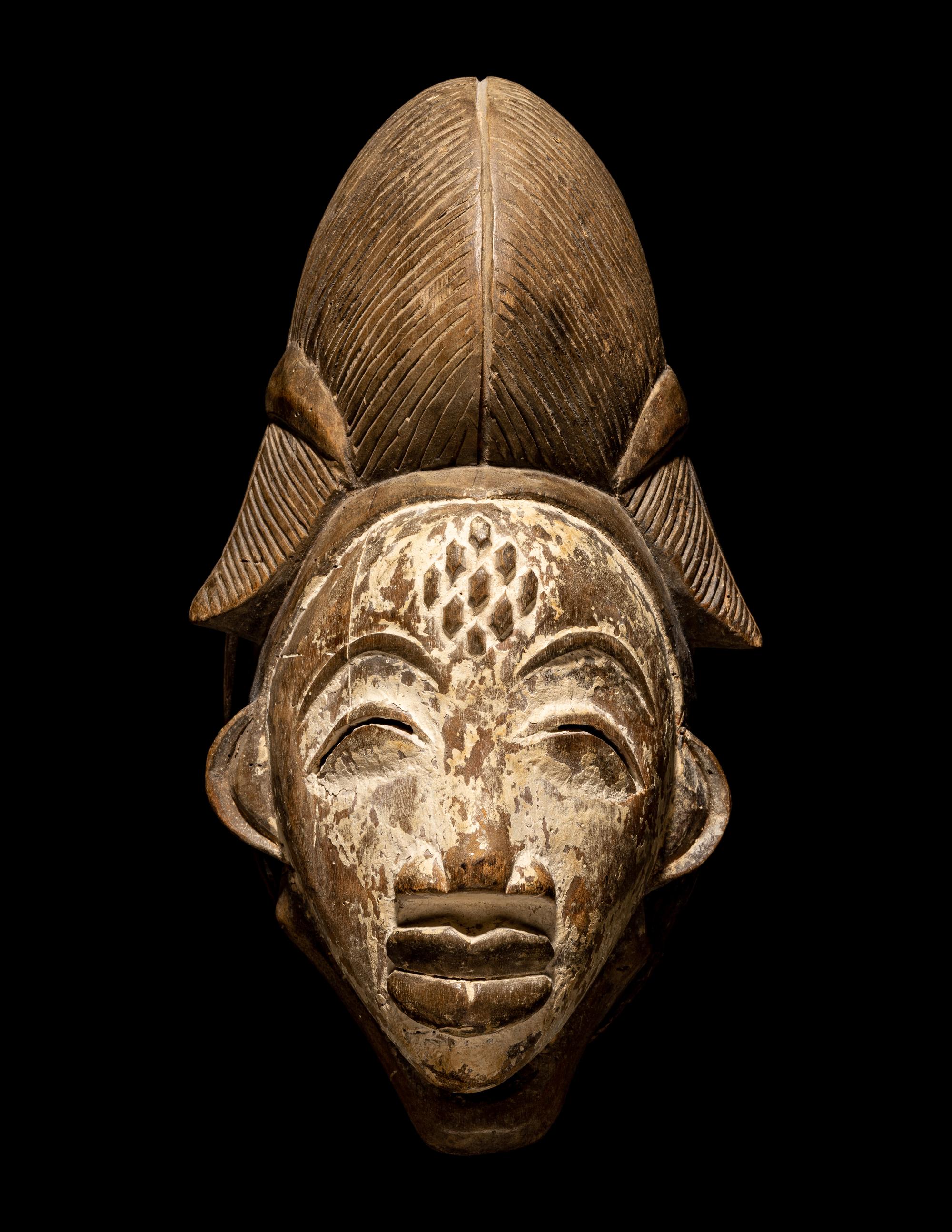 Four Punu Wood Masks