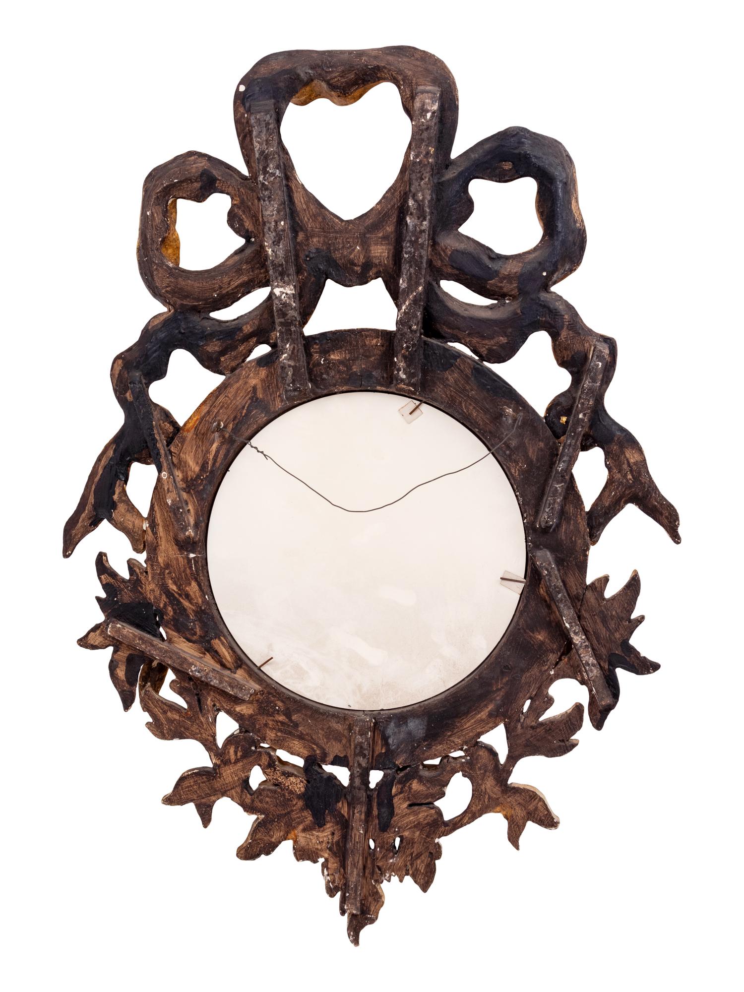 A Continental Carved Giltwood Convex Mirror