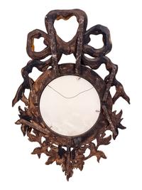 A Continental Carved Giltwood Convex Mirror