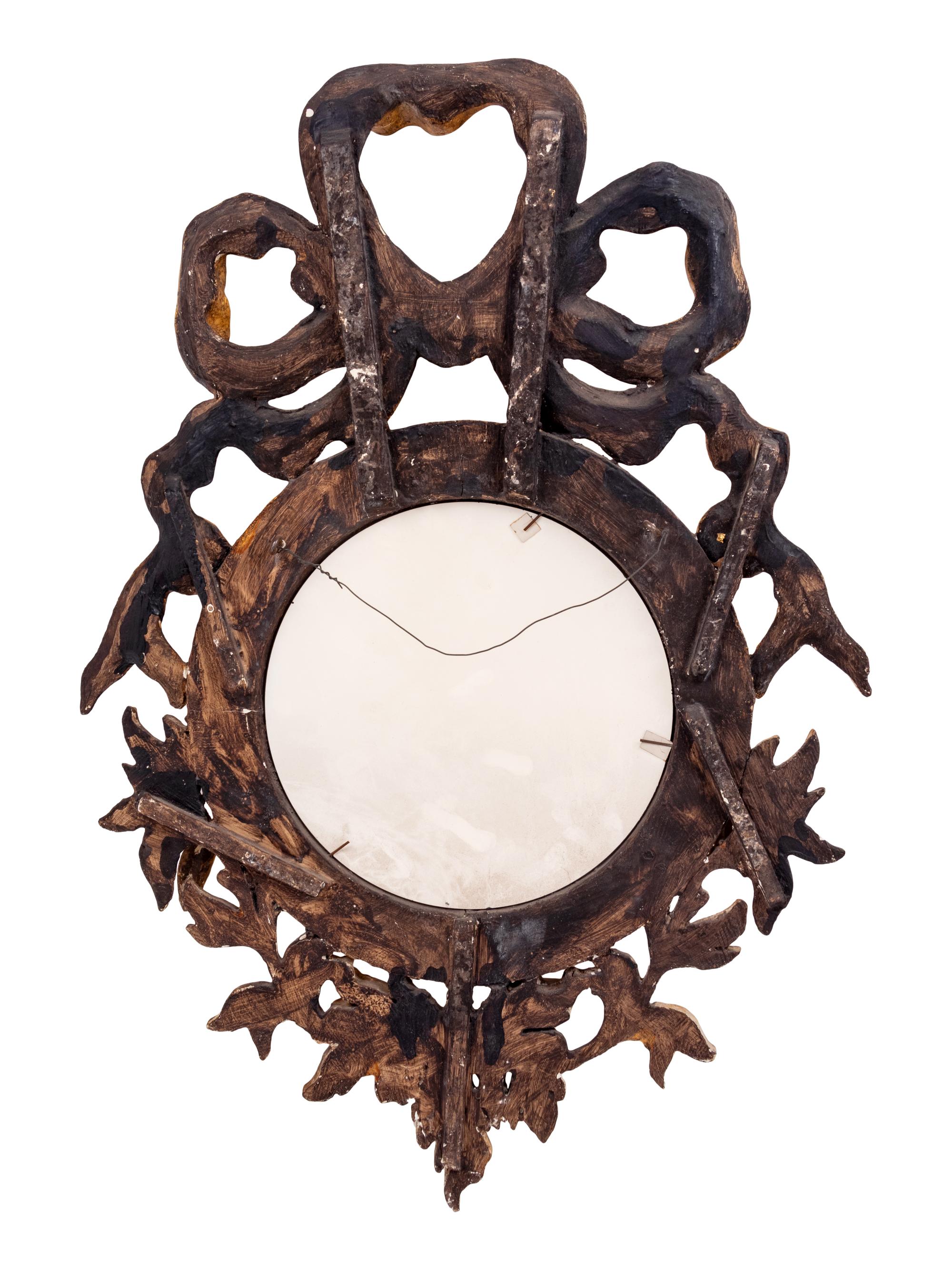 A Continental Carved Giltwood Convex Mirror