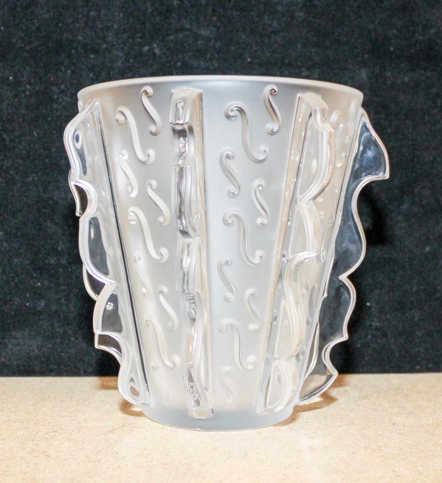 A Lalique Molded and Frosted Glass Vase. Height 7 1/4 inches.