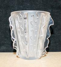 A Lalique Molded and Frosted Glass Vase. Height 7 1/4 inches.