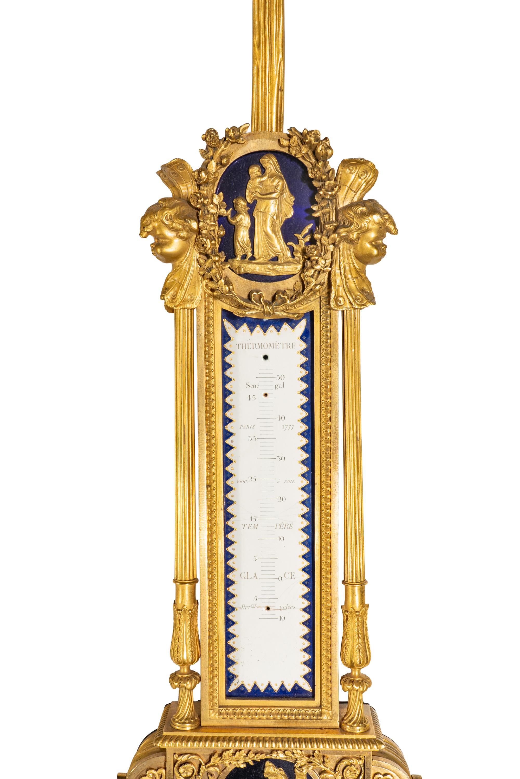 A French Gilt Bronze, Blue Steel, and Enamel Cartel d'Applique and Barometer