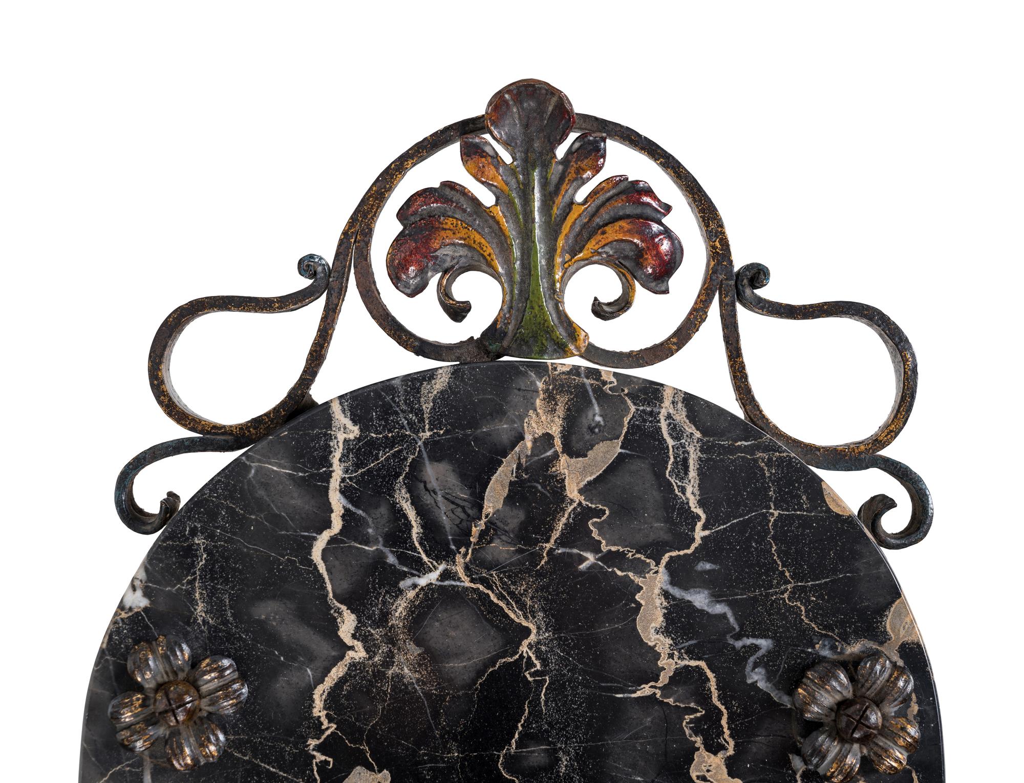 A Wrought Iron and Marble-Top Table
