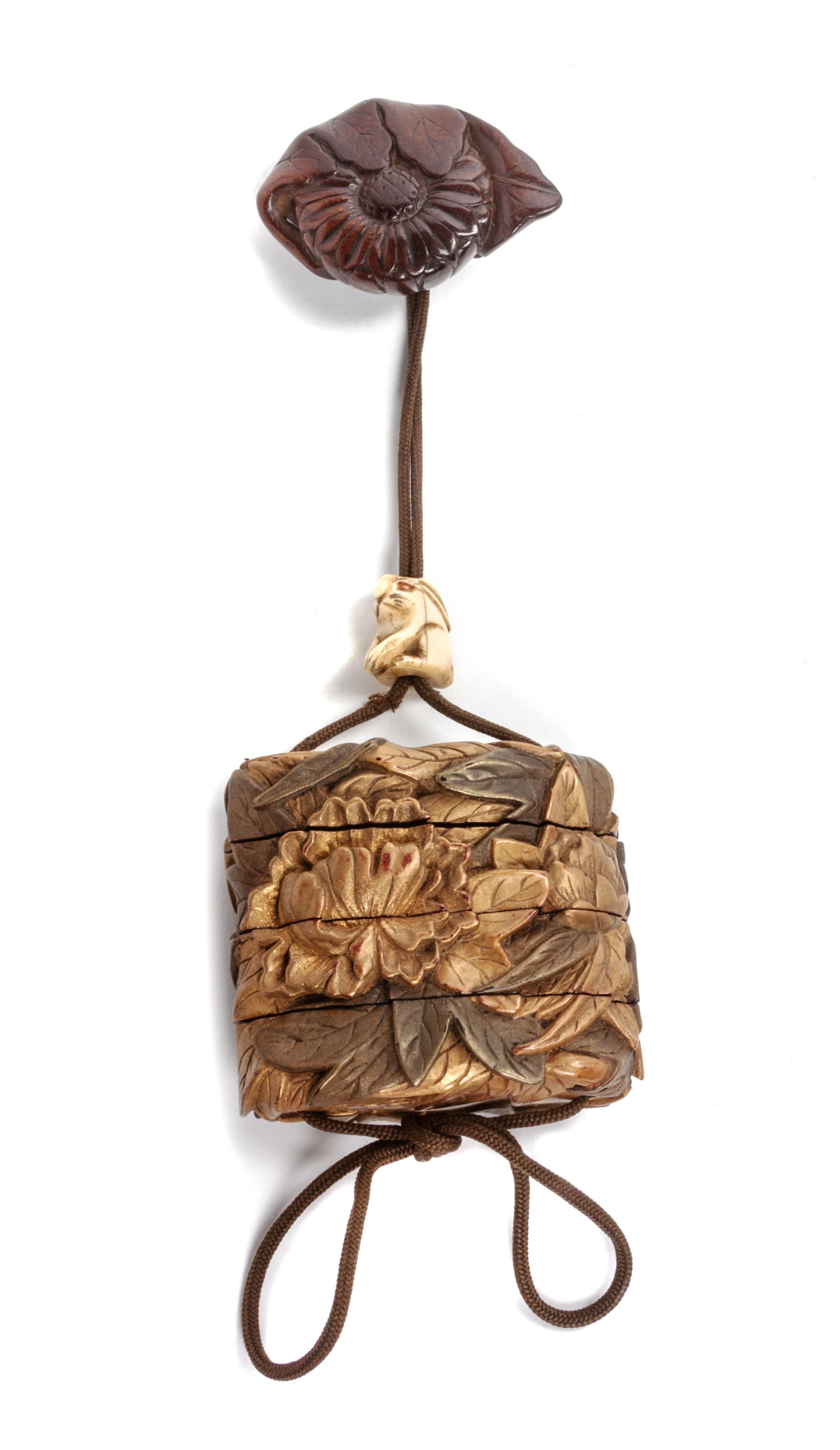 A Japanese Gilt Lacquer Three-Tier Inro Height 2 1/4 inches.