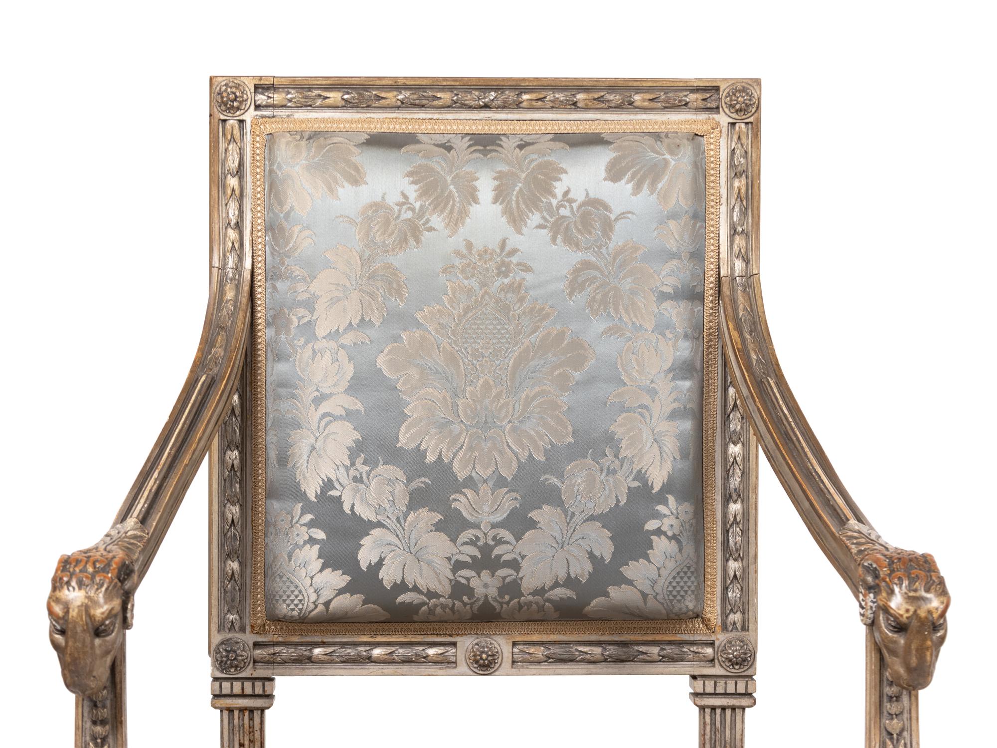 A Pair of Louis XVI Style Carved and Silver Paint Decorated Fauteuils