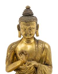 A Sino-Tibetan Gilt Bronze Seated Figure of Buddha Shakyamuni