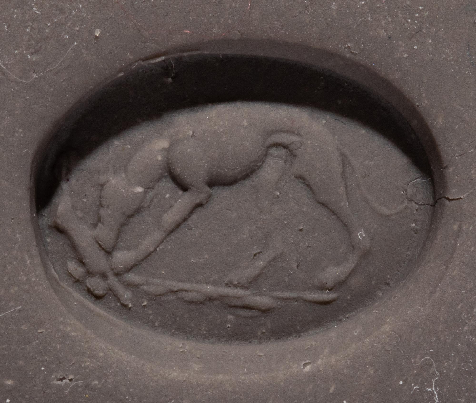 A Roman Red Jasper Ring Stone with a Coursing Hound and Hare