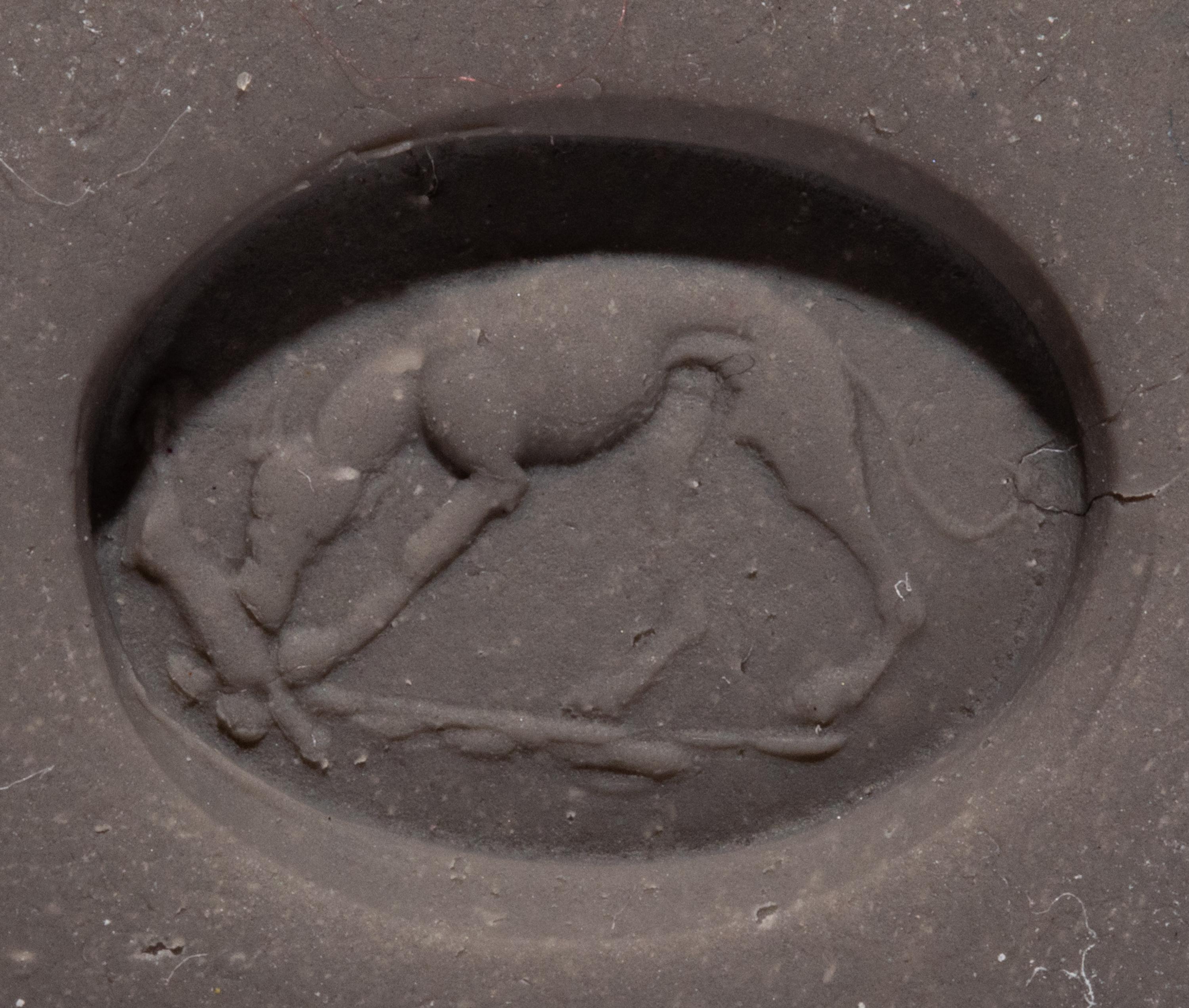 A Roman Red Jasper Ring Stone with a Coursing Hound and Hare