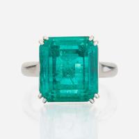 An emerald and platinum ring, Cartier