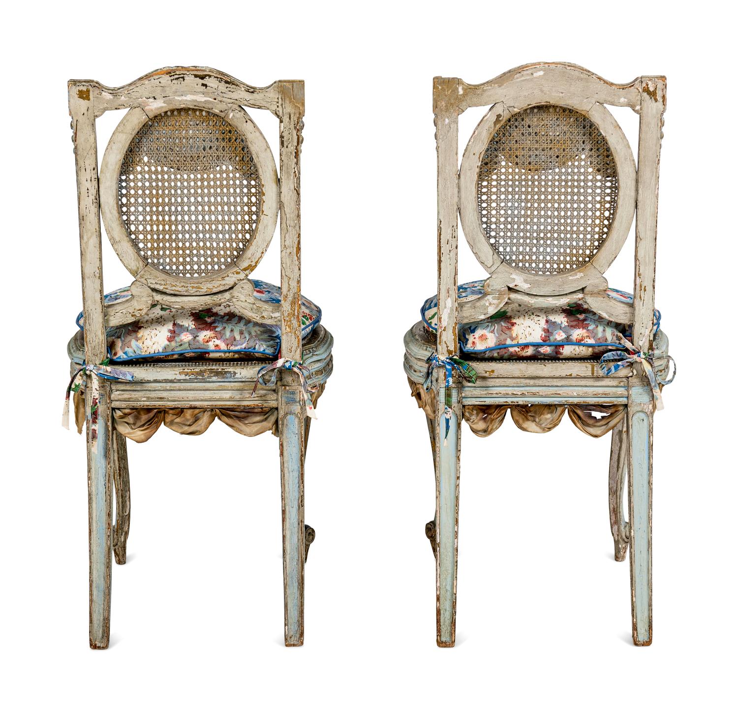 A Pair of Louis XVI Style Painted and Parcel-Gilt Chaises